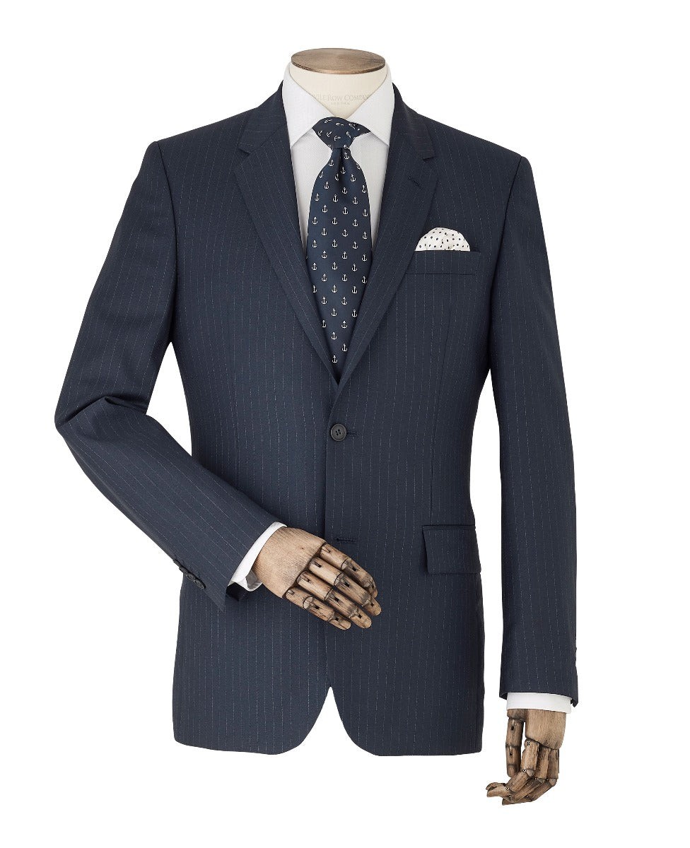 Navy striped tailored suit jacket featuring a single button closure, notch lapels, and a chest pocket with a white pocket square, displayed on a mannequin with a wooden hand.