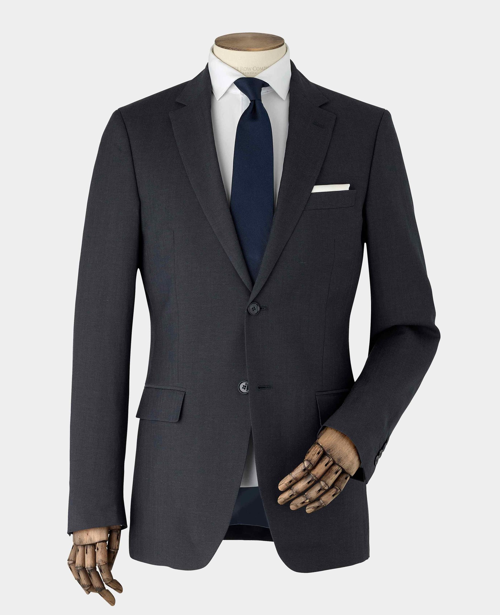 Navy wool-linen blend suit jacket in size 40X Short, featuring a notched lapel, two front pockets, and a single button closure, displayed on a mannequin with a white shirt and navy tie.