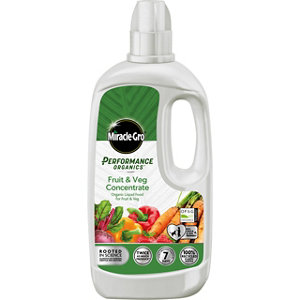 White plastic bottle of Miracle-Gro Performance Organics Fruit & Veg Concentrate, featuring a green label with images of fruits and vegetables, and a convenient handle for easy pouring.