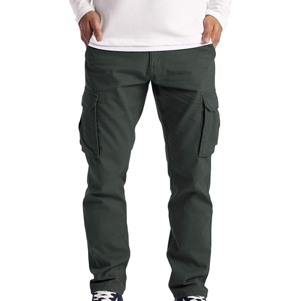 Dark green cargo pants with multiple side pockets, a relaxed fit, and a comfortable waistband, paired with a white long-sleeve shirt and navy sneakers.