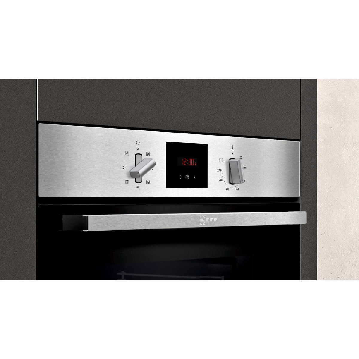 Stainless steel built-in electric single oven with a sleek control panel, featuring digital display and two knobs for temperature and function selection.