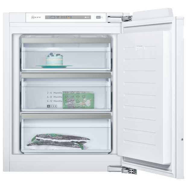 White integrated undercounter freezer with three transparent drawers, digital control panel, and a cake on the top shelf, showcasing a sleek, modern design.