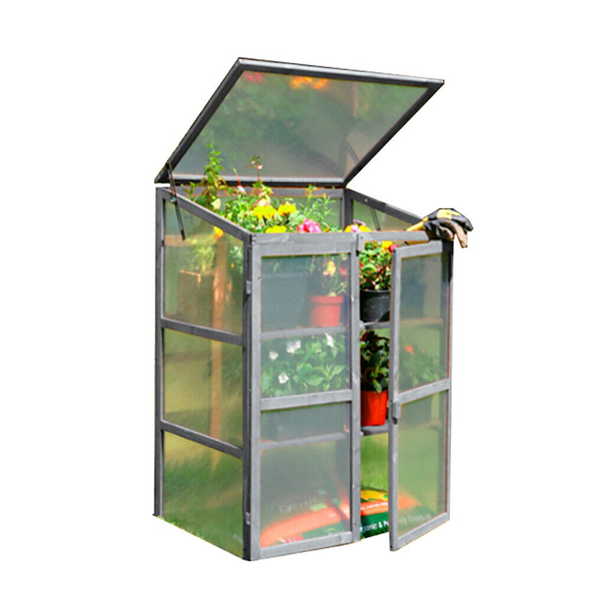 Grey wooden mini greenhouse with a slanted roof, transparent panels, and double doors, showcasing potted plants inside.