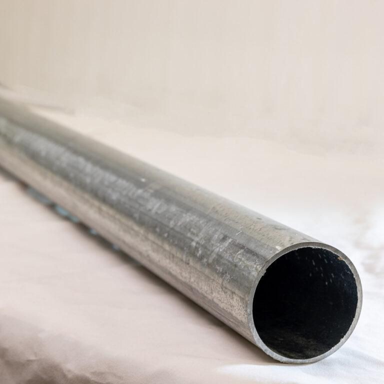 Silver metal pipe, 60mm diameter and 500mm length, with a smooth, shiny surface and open cylindrical end, reflecting light subtly.