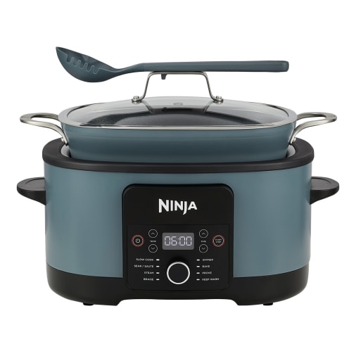 Ninja 42cm Multi Cooker in blue with a sleek design, featuring a digital control panel, a glass lid, and a spatula, ideal for versatile cooking.