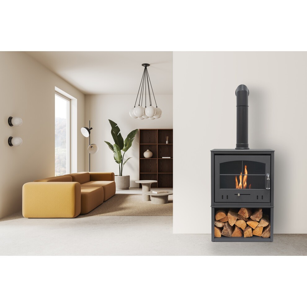 Charcoal grey OKO S4 Bio Ethanol Stove featuring a tall angled stove pipe and log storage, set in a modern interior with a yellow sofa and minimalist decor.