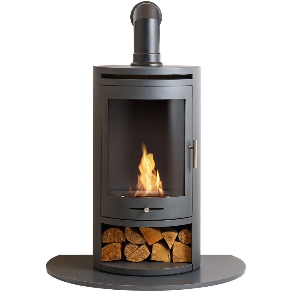 Black bio ethanol cylinder stove with a glass front, angled stove pipe, truncated hearth, and a storage compartment for logs beneath the flame.