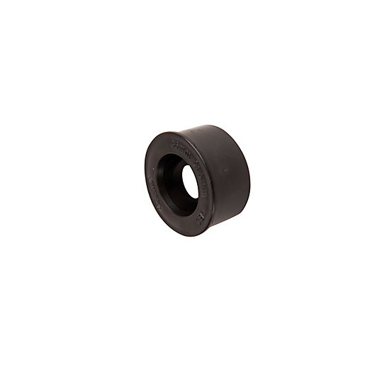 Black plastic overflow reducer with a 21.5mm diameter, featuring a smooth exterior and a central opening for pipe fitting, designed for plumbing applications.