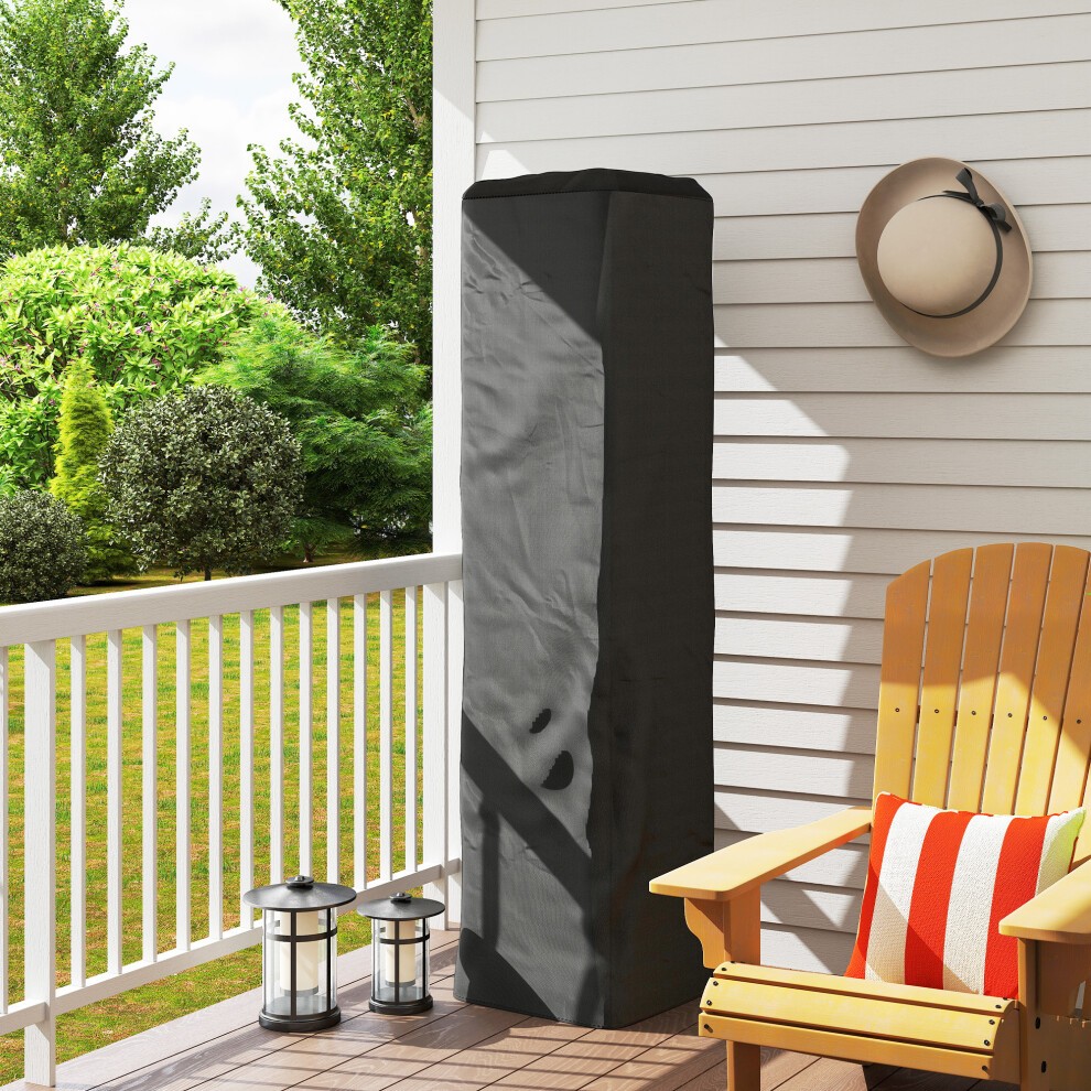 Heavy-duty black gas patio heater cover made of durable material, designed to protect the heater from the elements, placed on a balcony beside a wooden chair and lanterns.