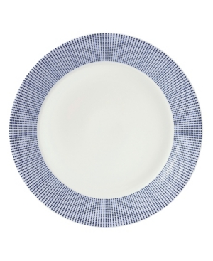White ceramic dinner plate featuring a vibrant Pacific Blue dotted rim design, showcasing a modern and elegant aesthetic.