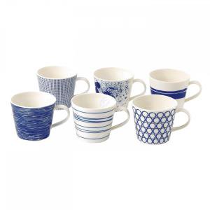 Set of 6 ceramic mugs in various blue patterns, including stripes, waves, and dots, featuring white interiors and comfortable handles, perfect for accenting any table setting.