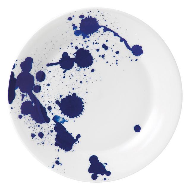 White ceramic side plate featuring a vibrant blue splash design with various splatters and droplets, creating an artistic and modern look.