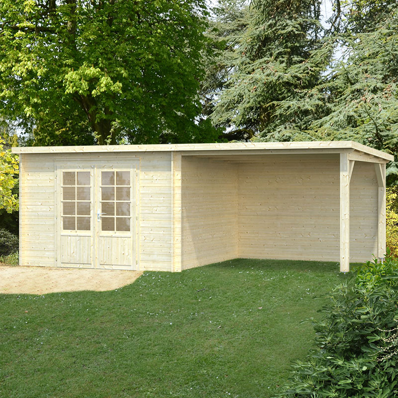 Light-colored wooden log cabin with a sloped roof, featuring double glass doors and large windows, set in a green garden surrounded by trees.