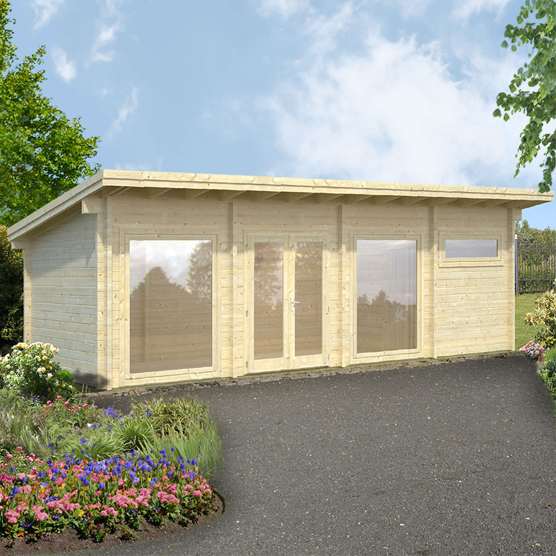 Light-colored wooden log cabin with large glass doors and windows, featuring a sloped roof, set amidst a landscaped garden with colorful flowers and greenery.