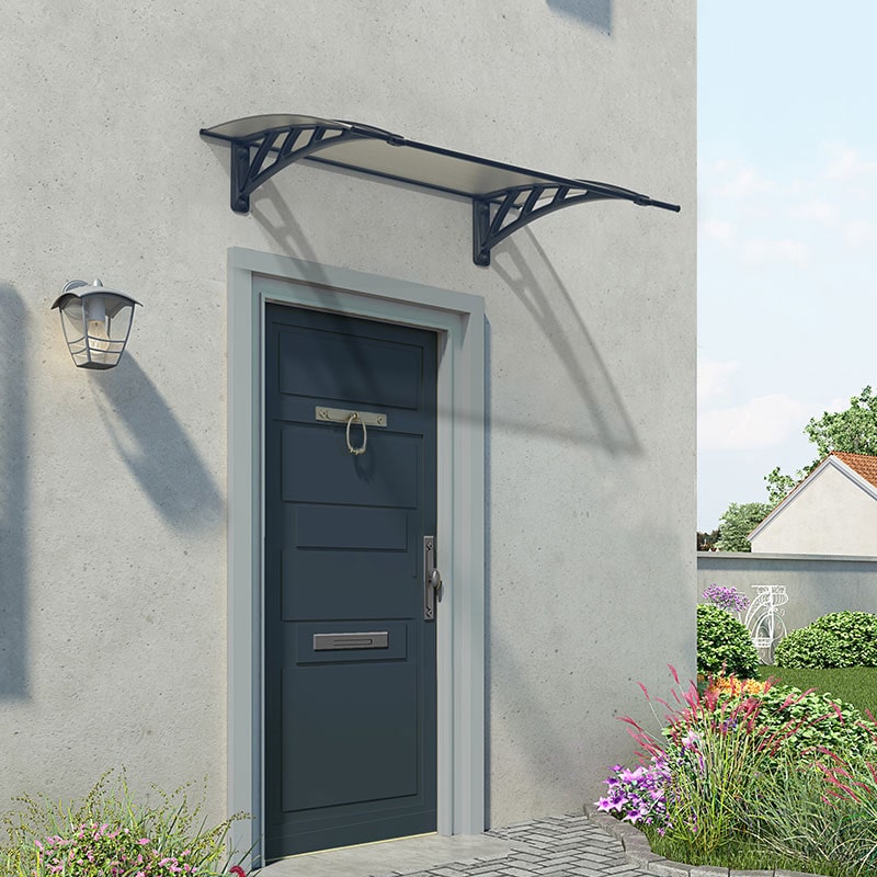 Grey twinwall door canopy with a sleek design, supported by decorative black brackets, enhancing the entrance of a modern home against a light grey wall.