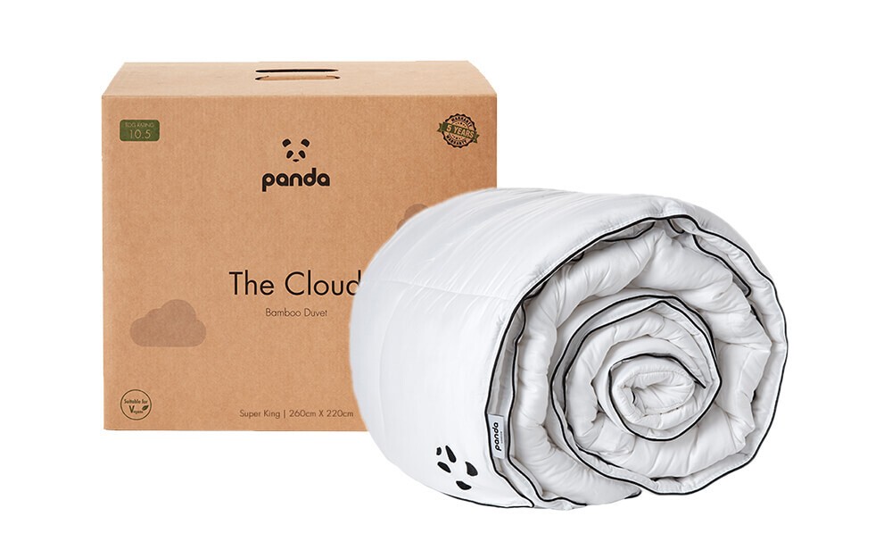 White 10.5 tog king-size duvet made from bamboo, rolled and displayed next to a brown cardboard box featuring the Panda logo and product name.