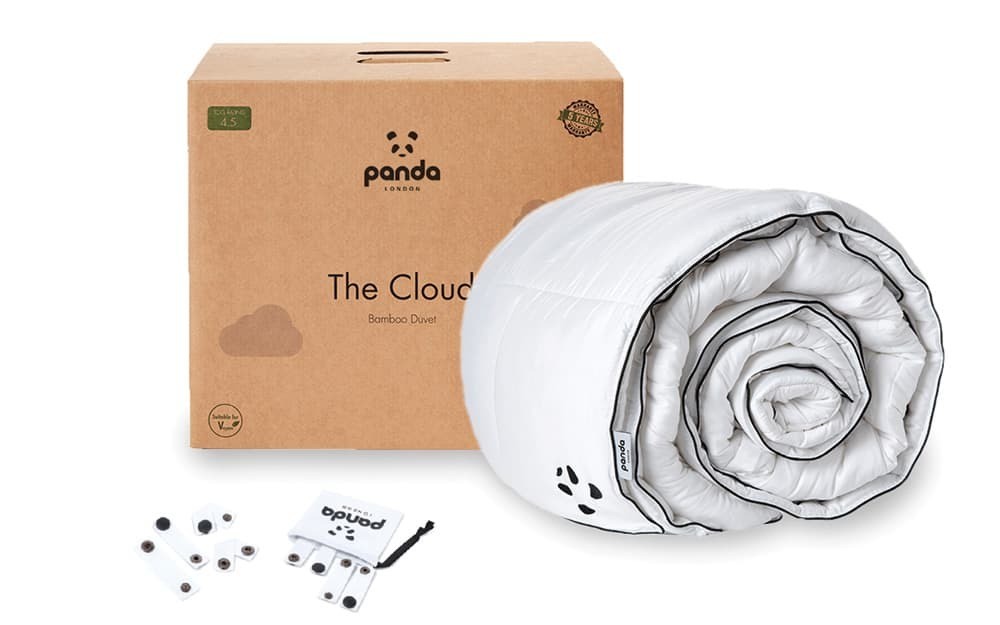 White superking duvet rolled up with a soft, quilted texture, made from bamboo, alongside a brown cardboard box labeled "Panda" and accessories.