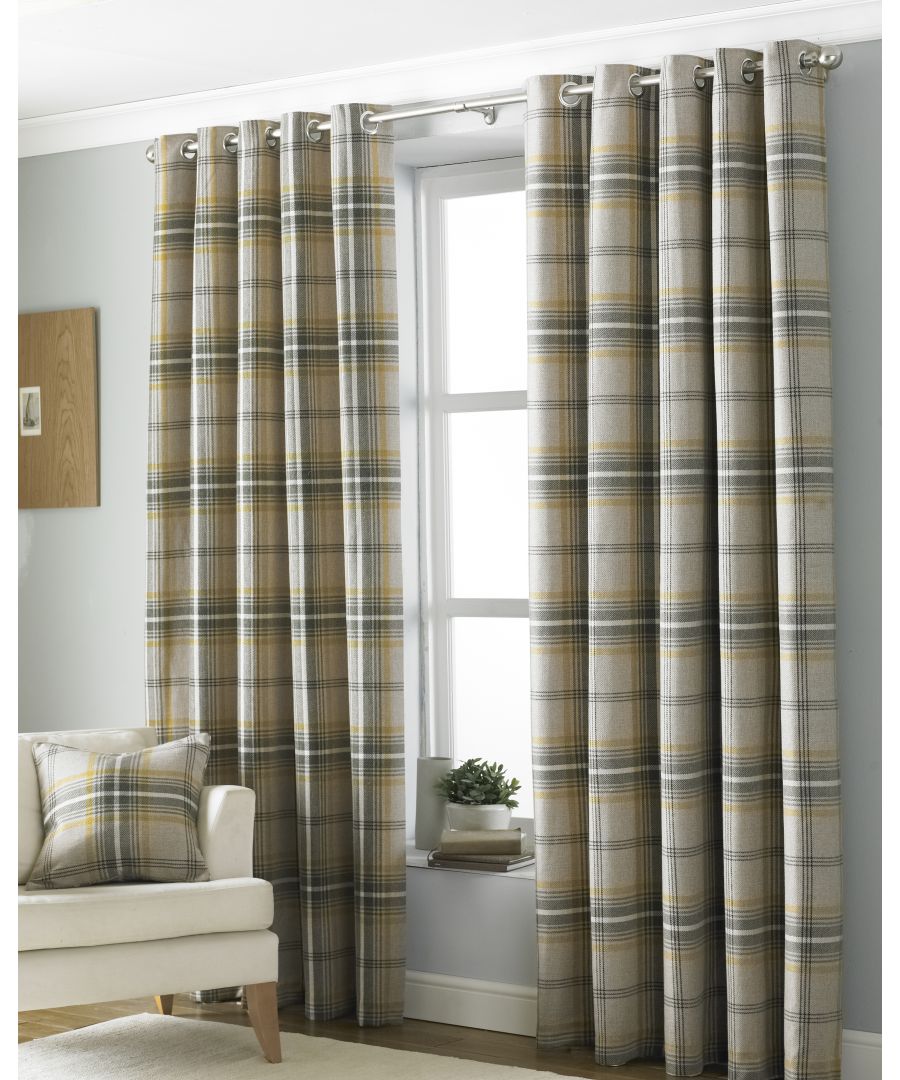 Yellow and grey tartan faux wool eyelet curtains, measuring 168cm wide by 183cm long, hang elegantly, complemented by a matching plaid cushion on a neutral-toned interior.