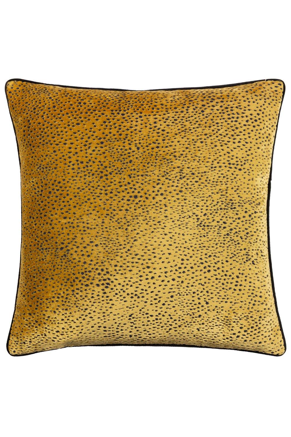 Gold cut velvet cushion featuring a spotted design, piped edges in black, and a plush fill, perfect for adding a touch of luxury to any decor.