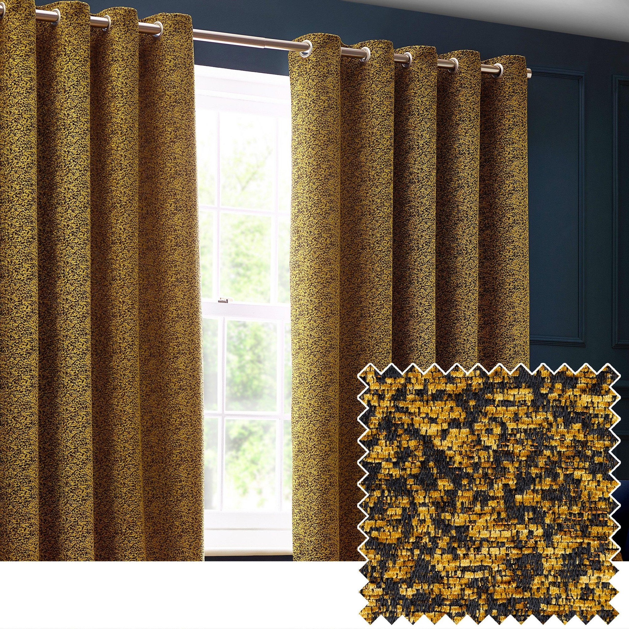 Gold velvet chenille eyelet curtains with a textured pattern, measuring 117cm width by 137cm drop, showcasing a luxurious design against a dark blue wall.