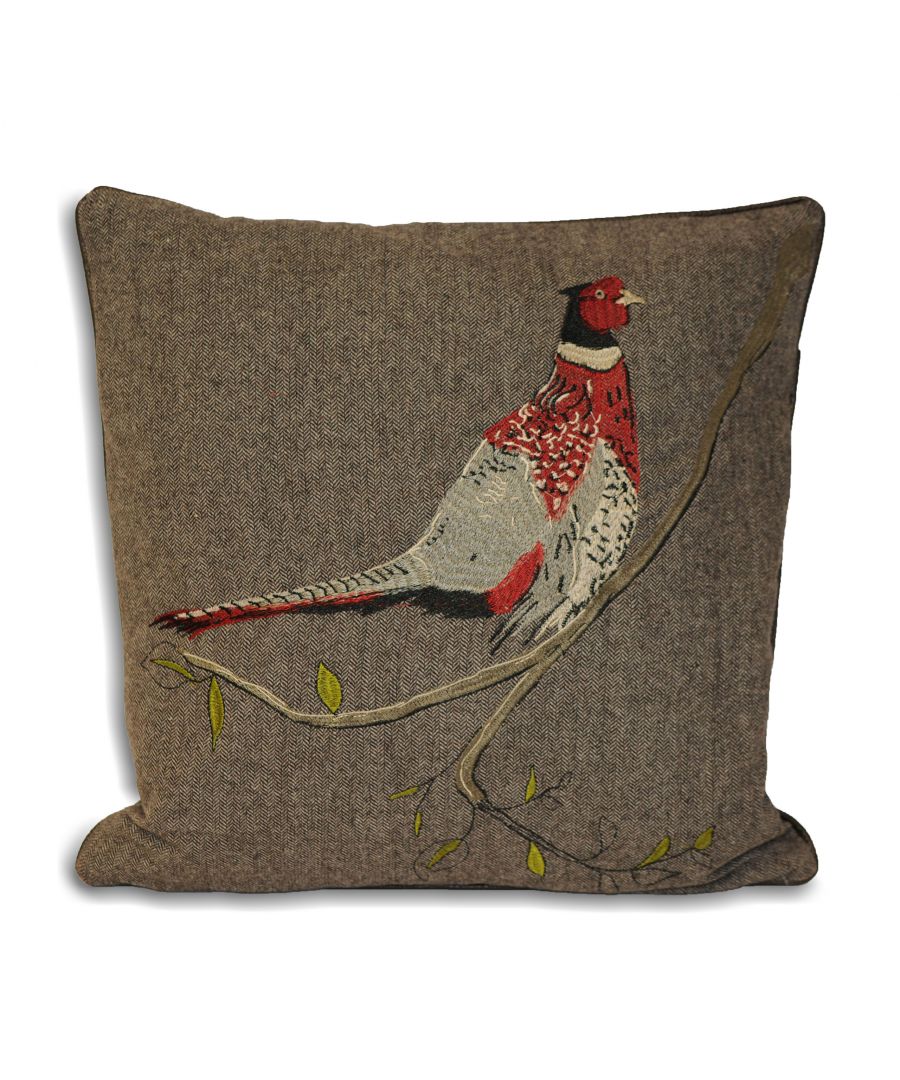 Herringbone-patterned cushion in muted brown velvet featuring an embroidered red and gray pheasant perched on a branch with green leaves.