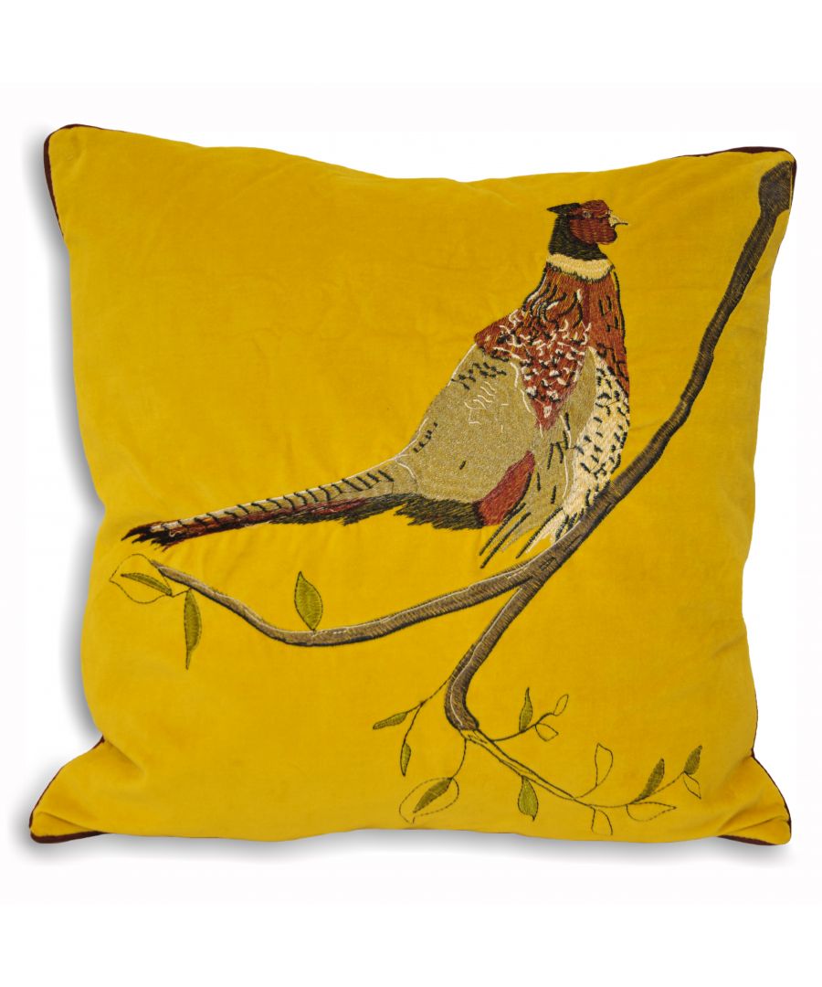 Mustard velvet cushion featuring an embroidered pheasant perched on a branch, with green leaves, measuring 45cm x 45cm.