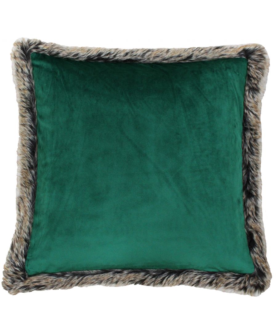 Emerald green soft velvet cushion with a faux fur trim in shades of brown and cream, measuring 45cm x 45cm, offering a luxurious and cozy accent.