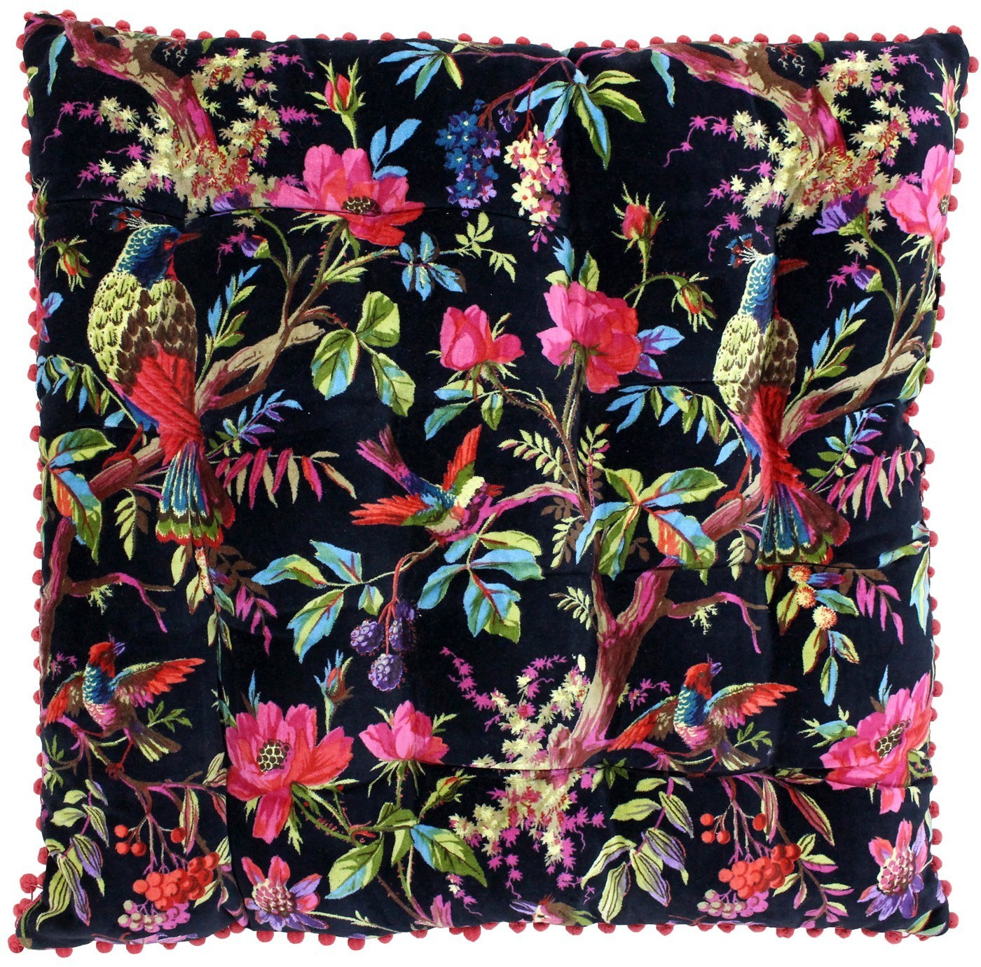 Black cotton floor cushion featuring vibrant floral and bird embroidery in pink, red, and green, accented with colorful pom-pom trim around the edges.