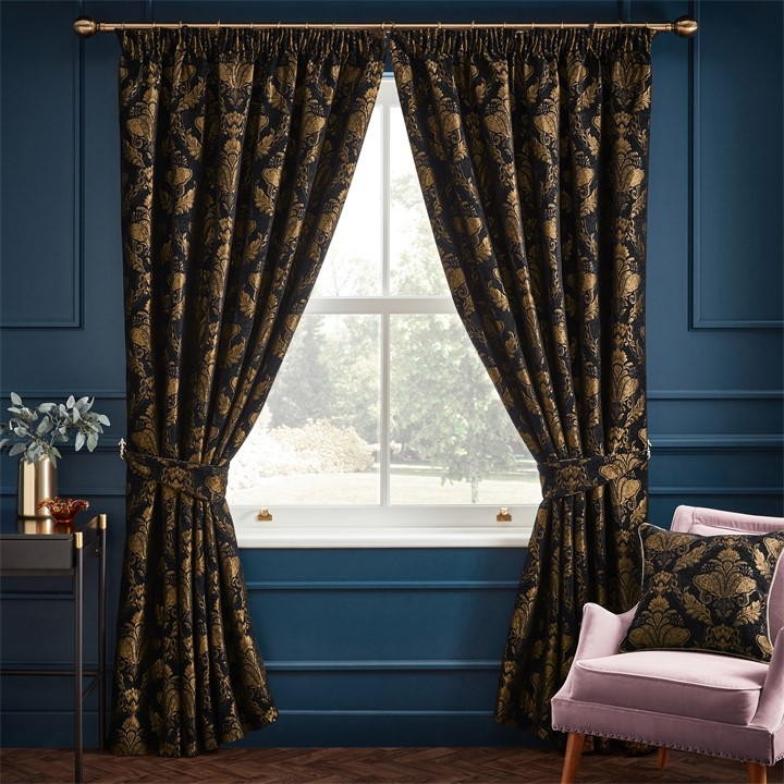 Black traditional jacquard pencil pleat curtains with a floral pattern, measuring 168cm wide by 229cm drop, elegantly framing a window against a blue wall.