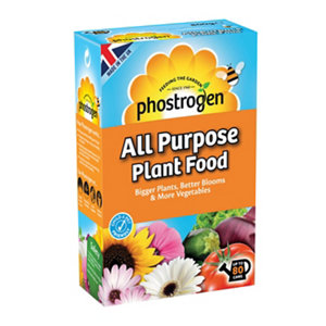 Bright orange box of Phostrogen All Purpose Plant Food, featuring a yellow flower logo, with text highlighting "80 Can + 50% Free," surrounded by colorful images of various plants and flowers.