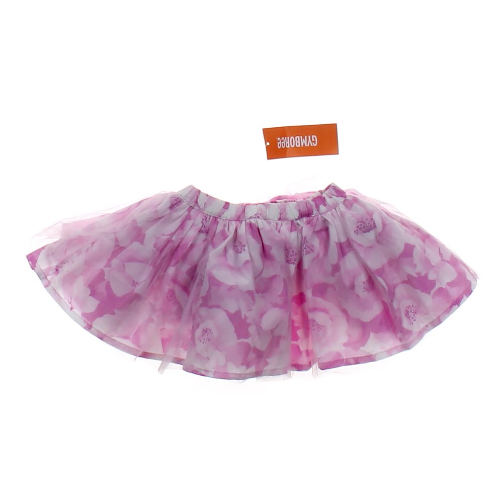 A fluffy, pink tutu skirt made of sheer material, featuring a floral design with white flowers, perfect for dress-up or playful occasions.