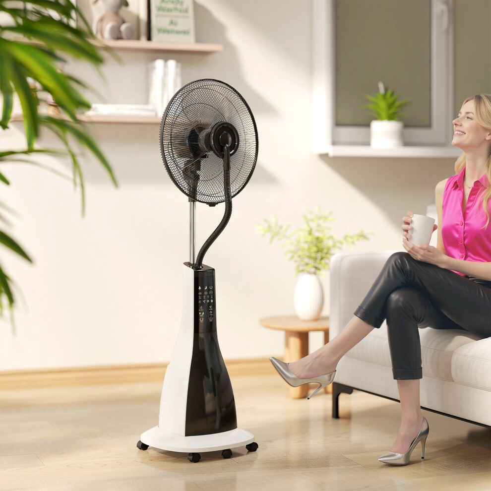 Homcom spray misting fan in white and black features a pedestal design, oscillation, tilt function, and wheels for mobility, positioned beside a woman enjoying a drink.