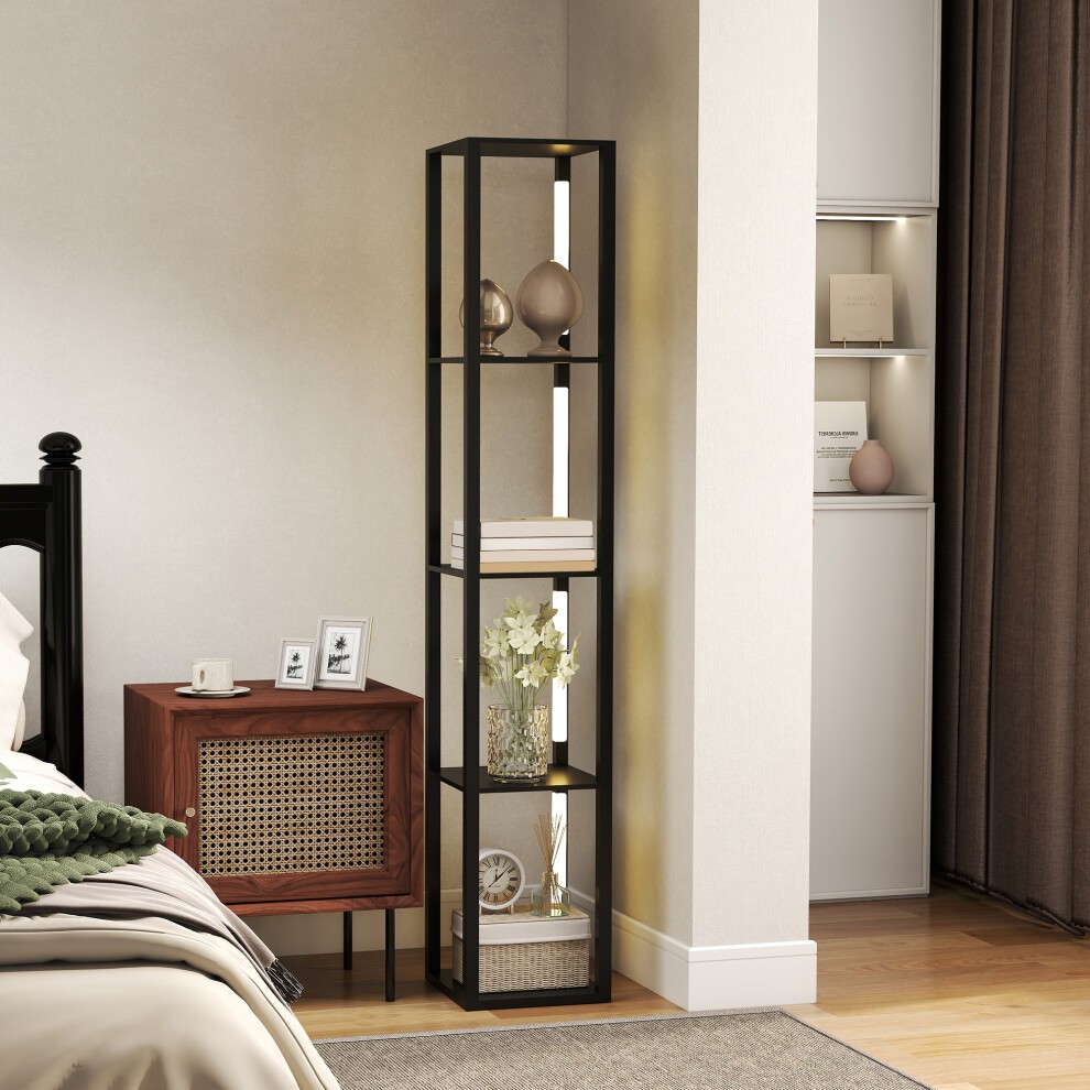 Tall black floor lamp with a sleek design, featuring a foot switch, standing beside a wooden nightstand in a cozy living room setting.
