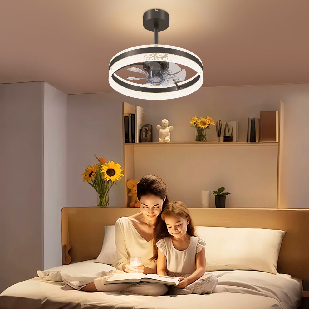 Black ceiling fan light with three color settings, timer, reversible blades, and remote control, featuring a sleek design and illuminated circular frame, installed in a cozy bedroom setting.