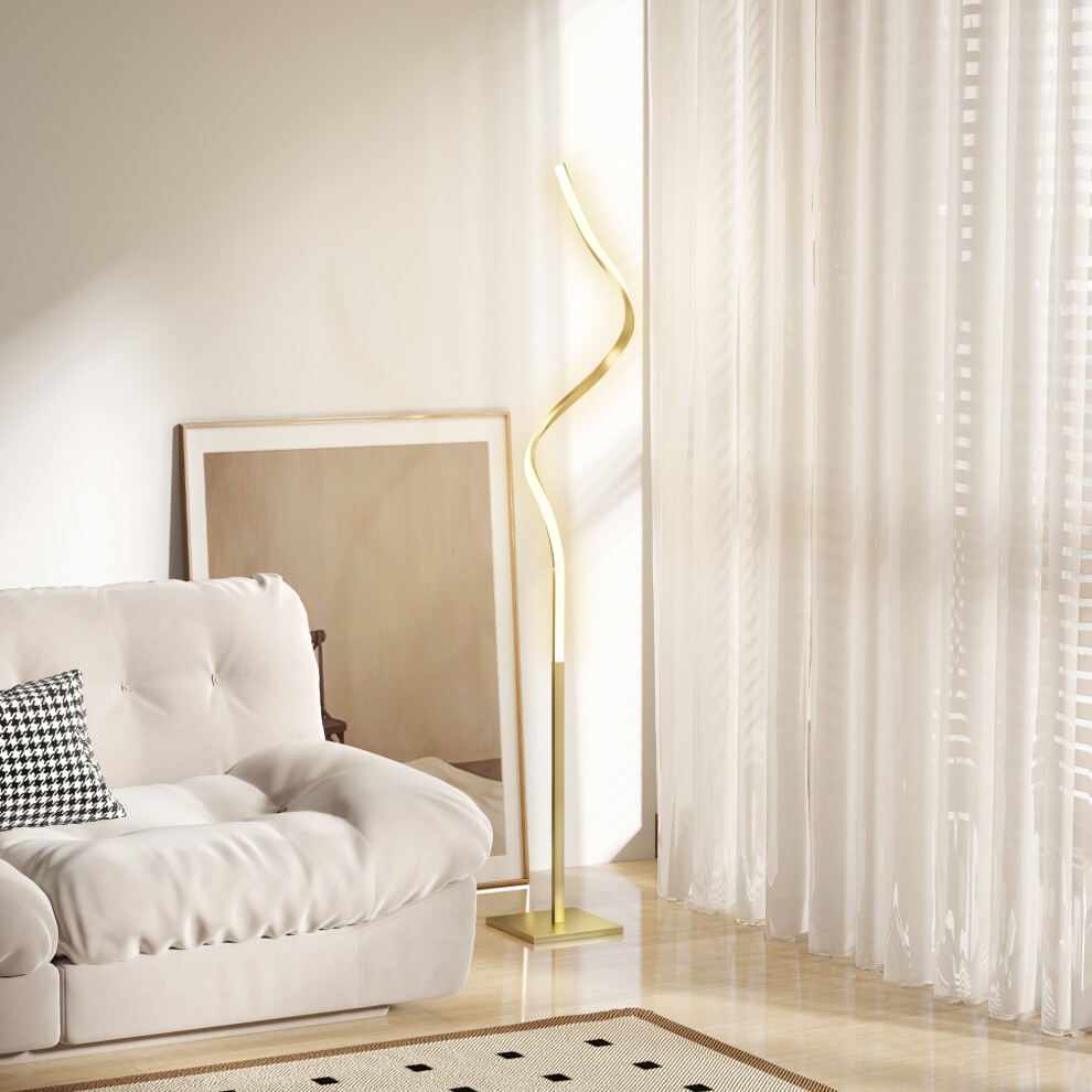 Gold-tone LED floor lamp with a sleek, wavy design, featuring three adjustable brightness settings, positioned near a light-filled window beside a cozy sofa.