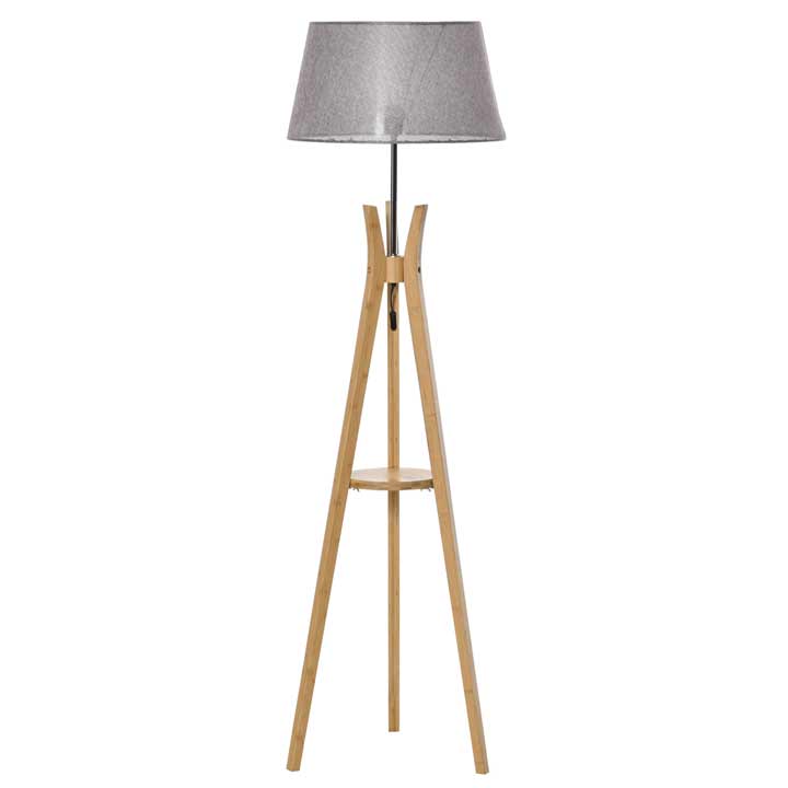Tripod floor lamp with a grey fabric shade and a wooden base featuring a storage shelf, combining modern design with functionality.