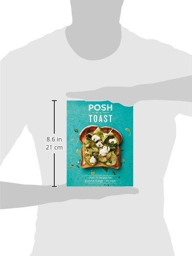 A hand holds a vibrant turquoise book titled "Posh Toast," featuring a toast dish with greens and cheese on the cover, measuring 8.6 x 21 cm.