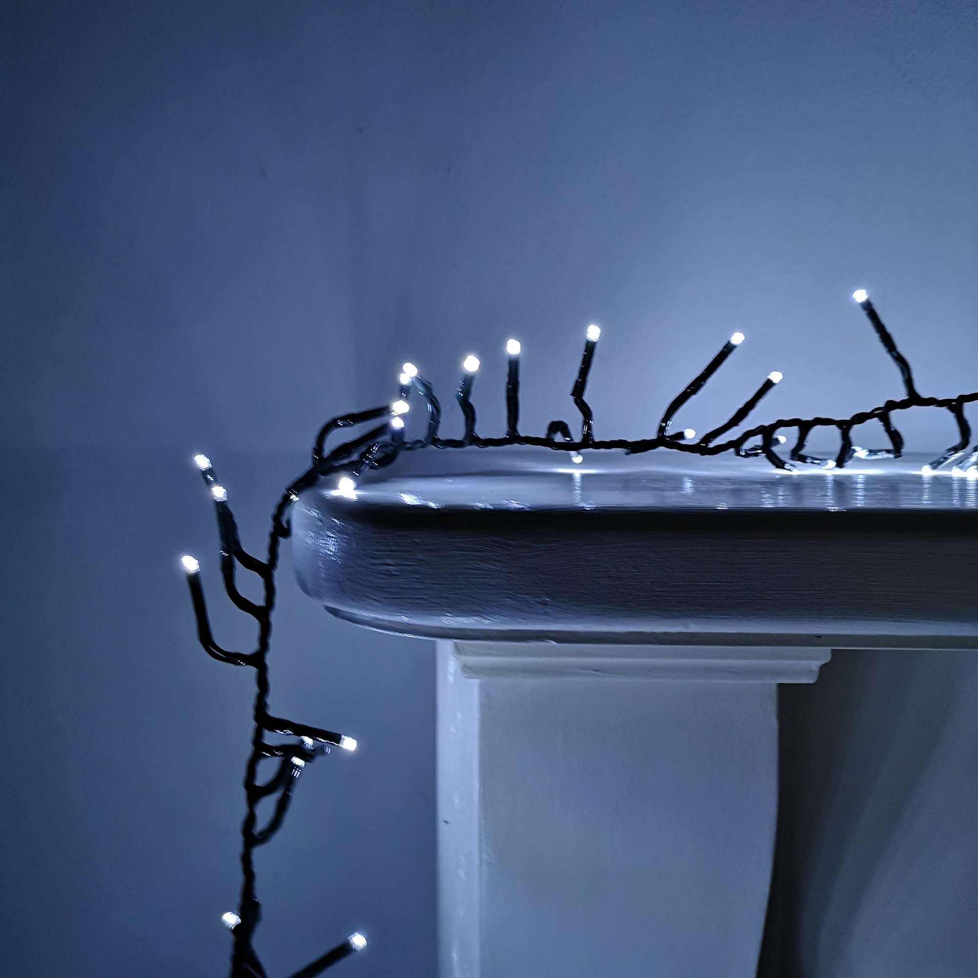 Premier Samuel Alexander 720 LED Christmas cluster lights, featuring cool white bulbs on a black wire, designed for mains operation, with a total length of 9.3 meters.