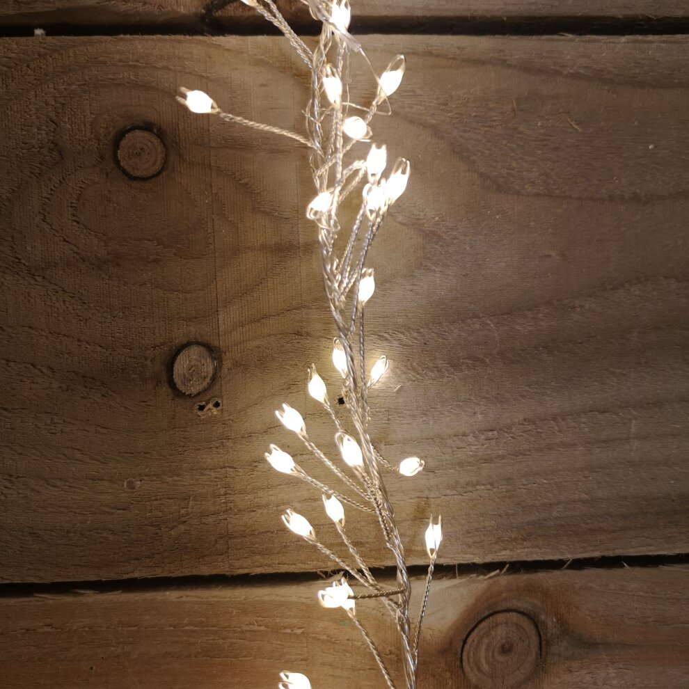 Warm white LED cluster lights on a flexible silver wire, featuring 800 bulbs arranged in a 5.5-meter length, ideal for indoor or outdoor Christmas decoration with a timer function.