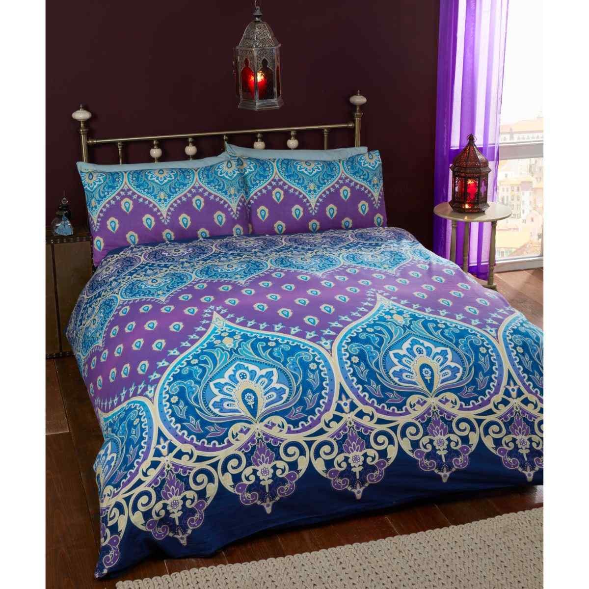 Vibrant king-size duvet cover set featuring intricate Indian design in sapphire blue and purple, made from a polyester-cotton blend, includes two matching pillowcases.