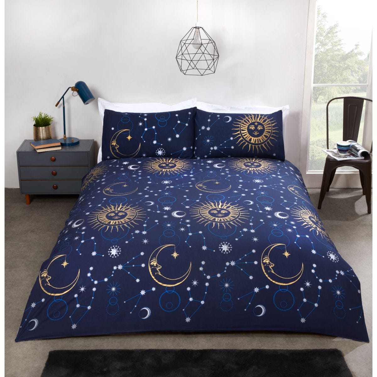 Navy and gold celestial duvet set featuring sun and moon designs, with matching pillowcases, set against a dark blue background, perfect for a stylish bedroom.