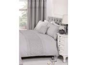 King-sized duvet set in silver, featuring a textured design, paired with matching pillowcases, elegantly displayed on a tufted headboard with a bedside table and lamp.