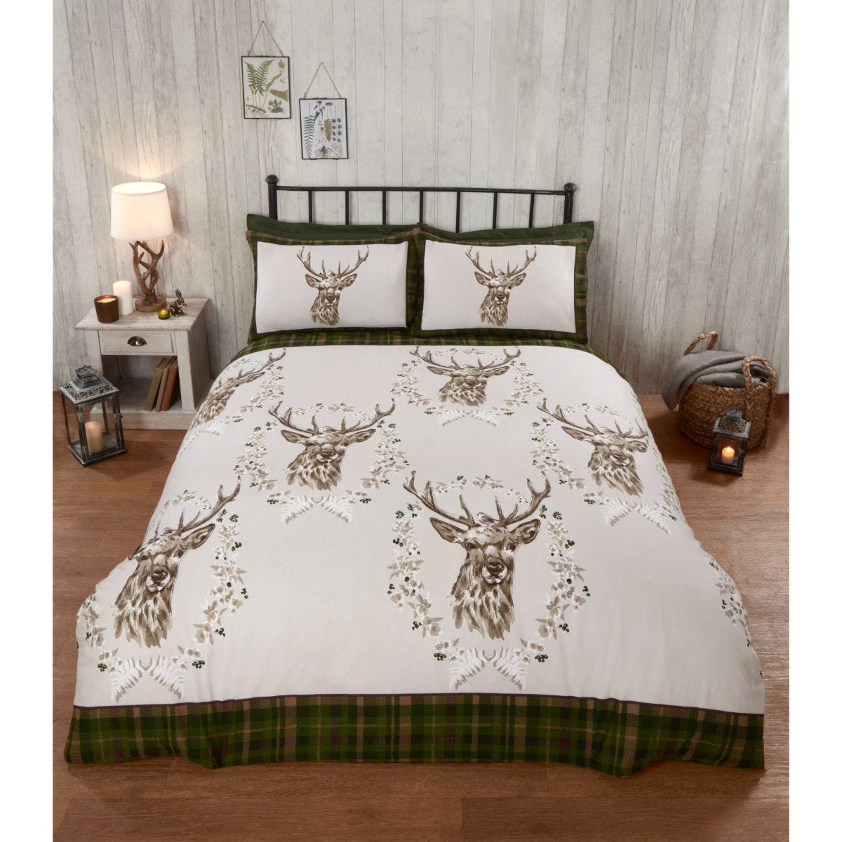Green king duvet set featuring a stag design, with detailed stag heads and floral accents on a white background, complemented by a plaid green border and matching pillowcases.