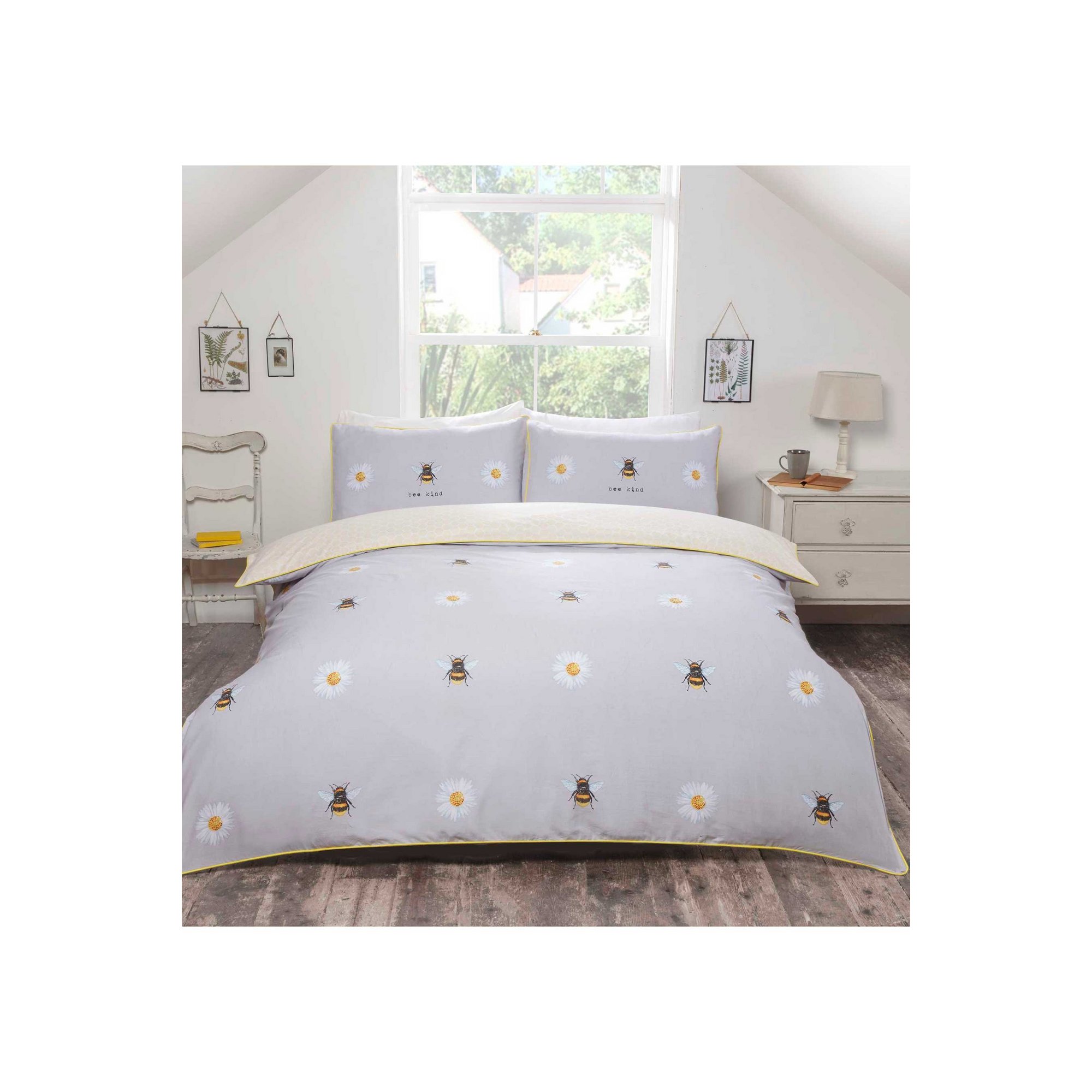 Light grey duvet set featuring embroidered bees and daisies, complemented by yellow piping, includes two matching pillowcases, made from soft, comfortable material.