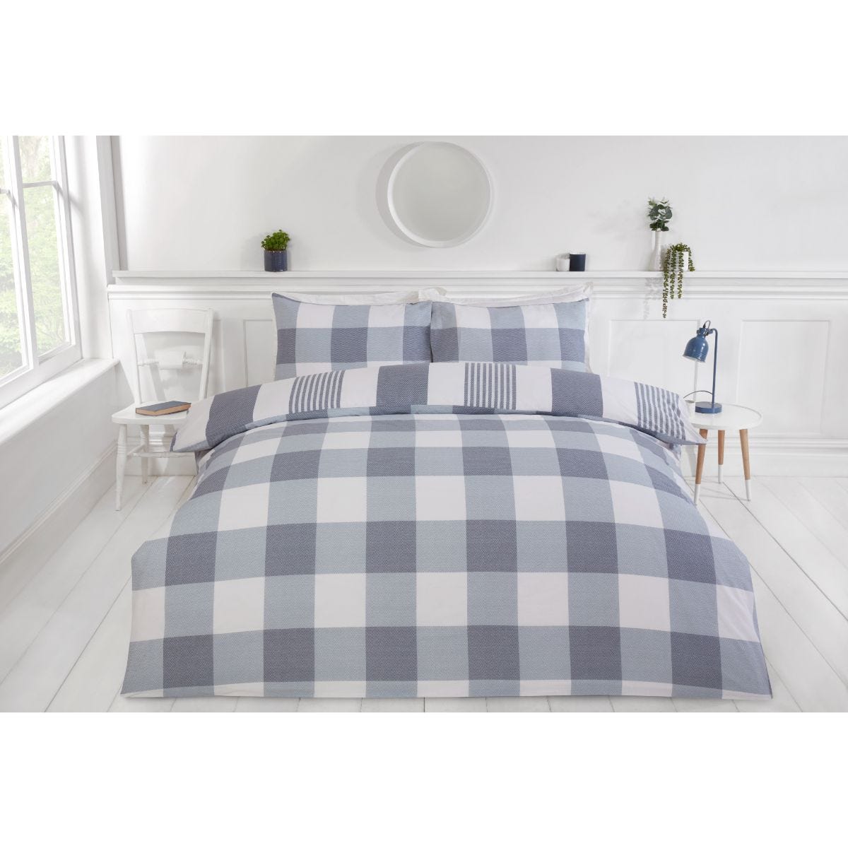 Reversible grey chambray stripe duvet cover set featuring a checkered pattern, soft fabric, and matching pillowcases, styled in a bright, minimalist bedroom setting.