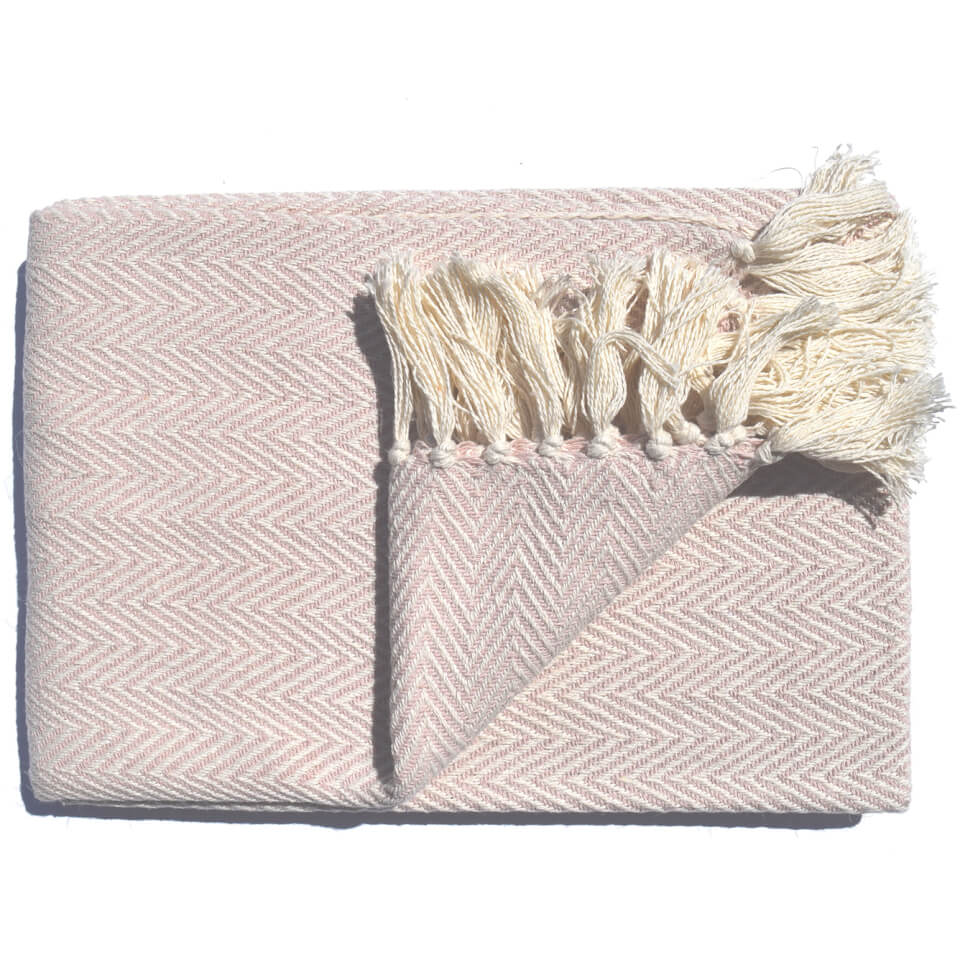 Blush pink throw blanket with a herringbone pattern, featuring soft fringed edges, measuring 127x152 cm, made from cozy material.