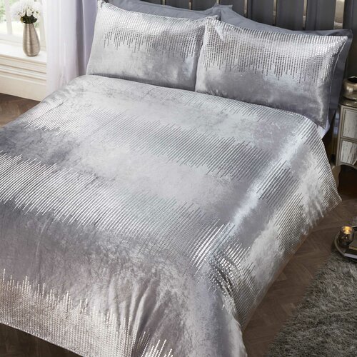 Silver double duvet set featuring a luxurious velvet texture with a shimmering pattern, complemented by matching pillowcases, perfect for a stylish bedroom.