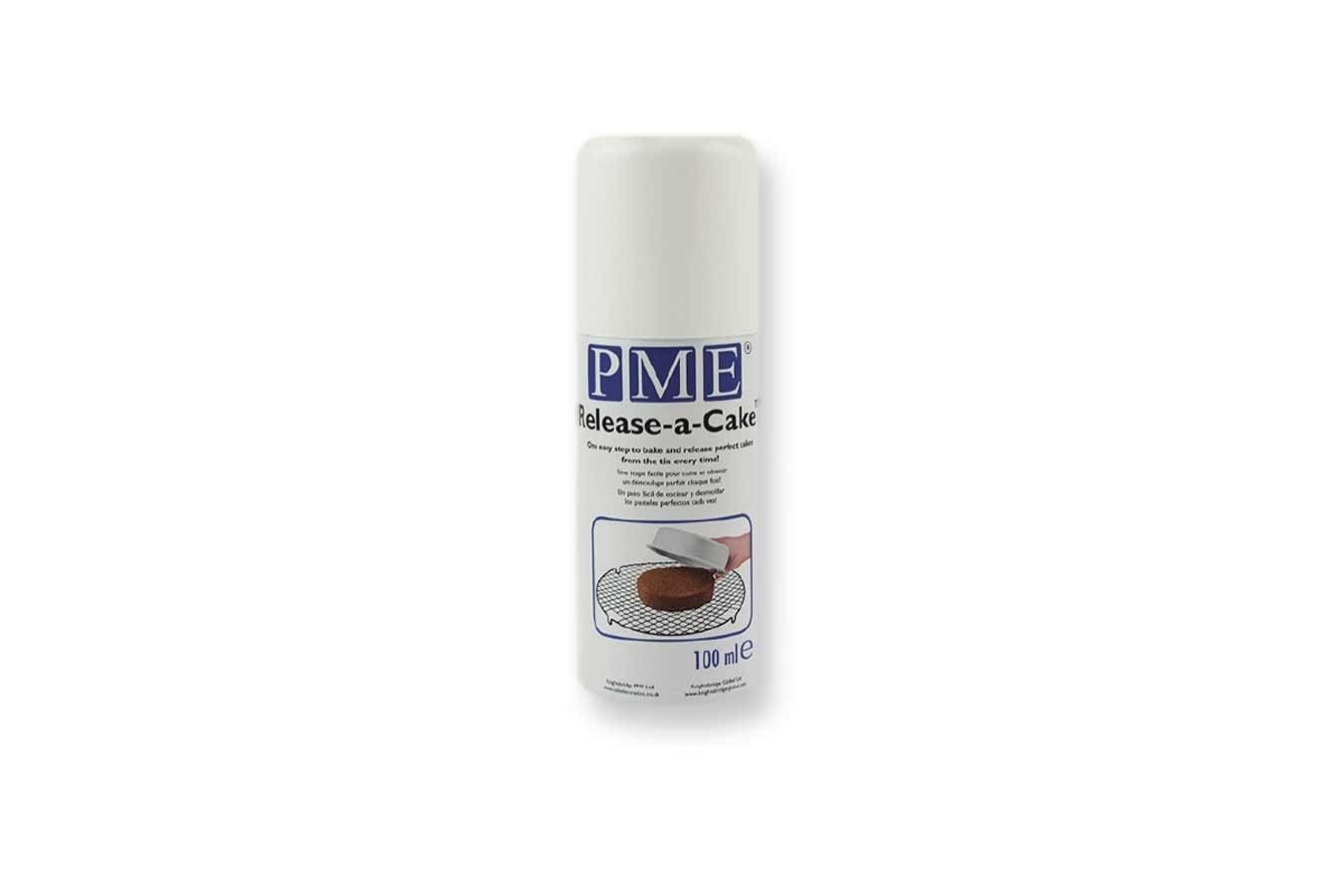 White aerosol spray can with a blue and purple label, labeled "PME Release-a-Cake 100ml," featuring a graphic of a cake being released from a pan.