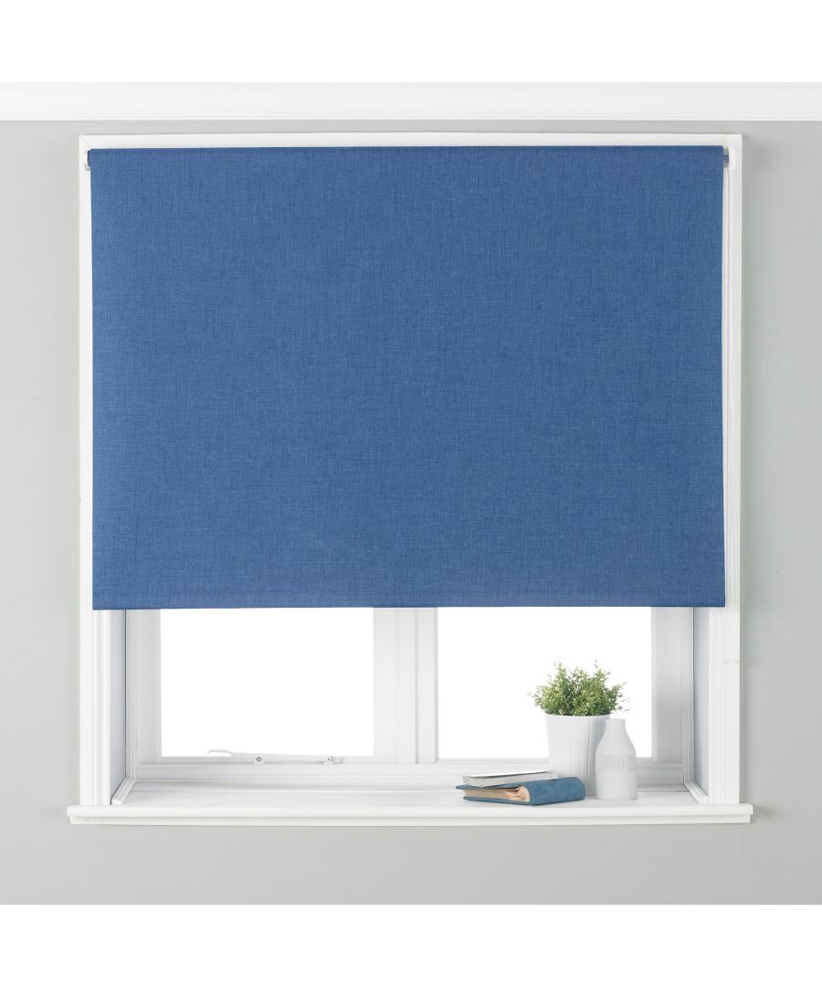 Twilight blackout roller blind in denim blue, made of polyester, measuring 122x162 cm, neatly fitted in a window frame with a small plant and folded fabric below.