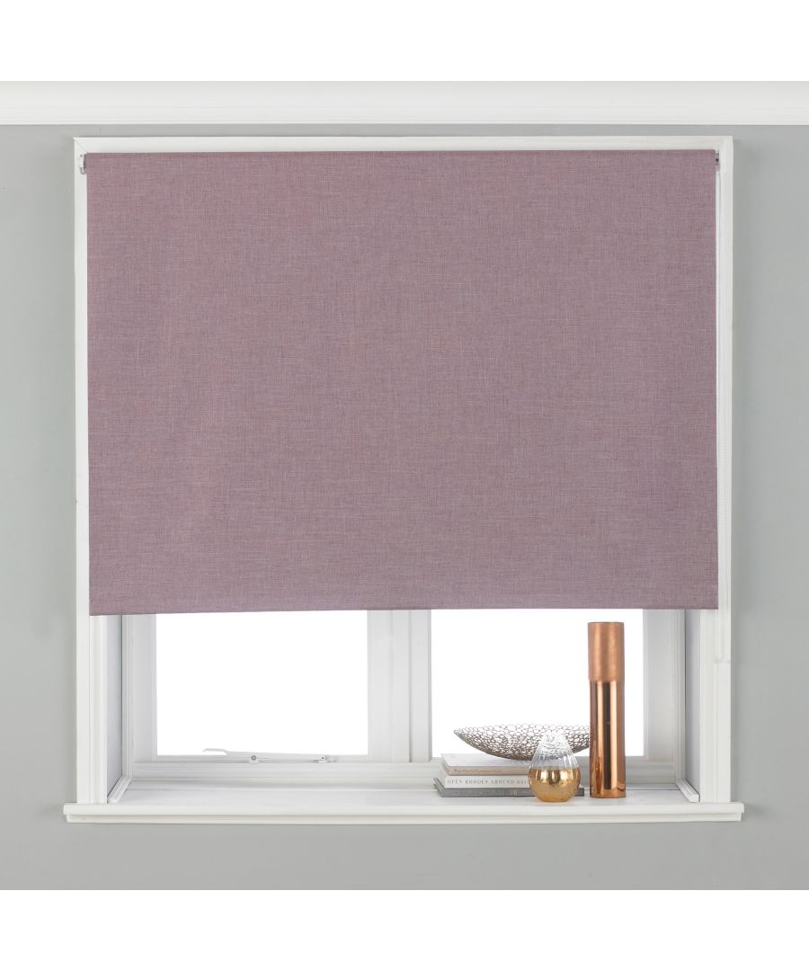 Mauve polyester blackout roller blind measuring 61 x 162cm, neatly rolled down in a window frame, complementing a modern interior with decorative items on the sill.